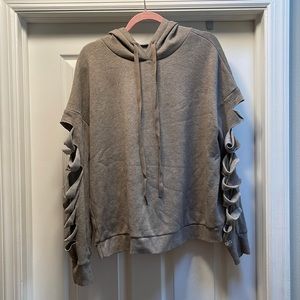 Alo hoodie with ripped design on sleeves. Size L. Like new super soft and comfy!